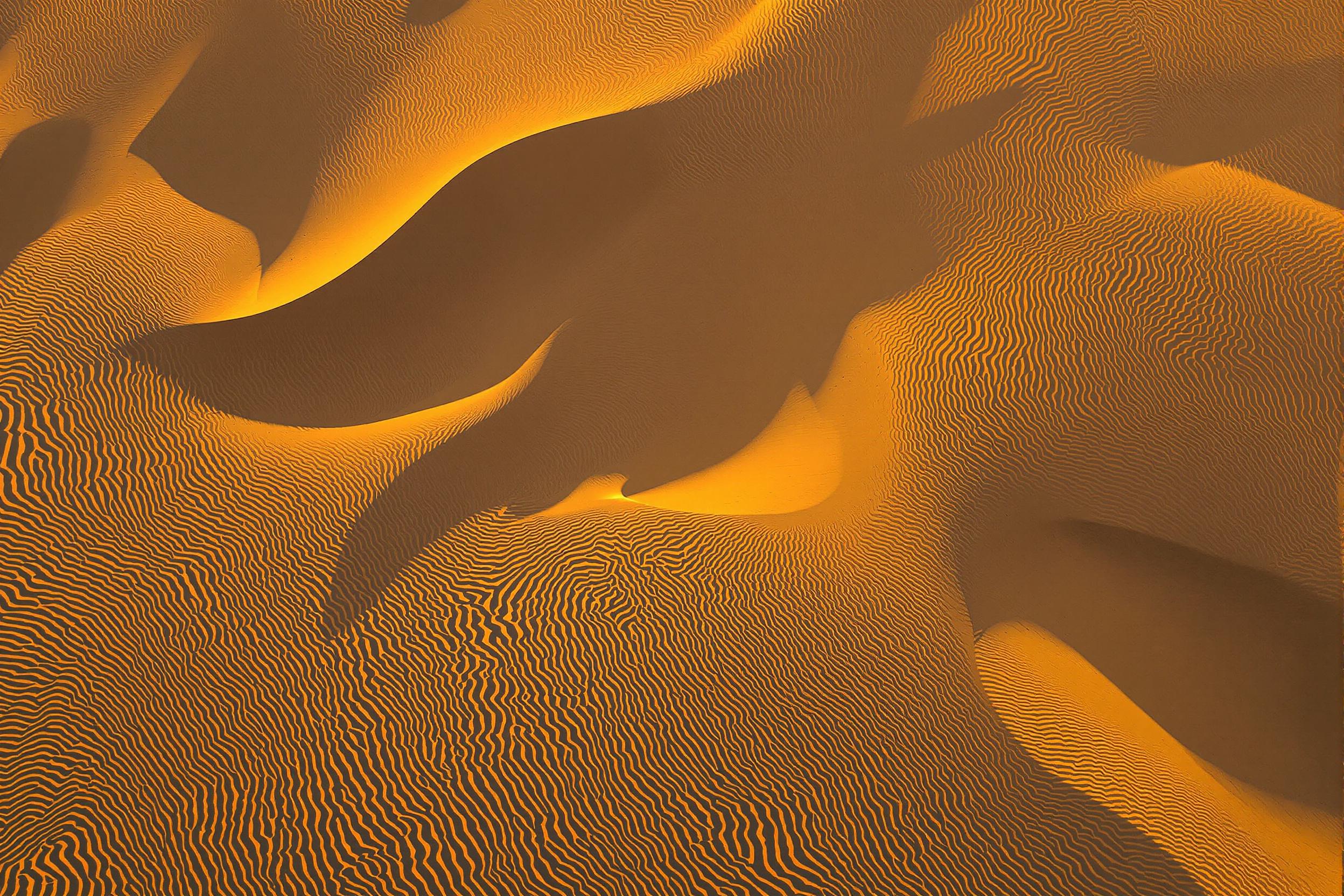 Abstract Aerial Golden Sand Dunes in Evening Light