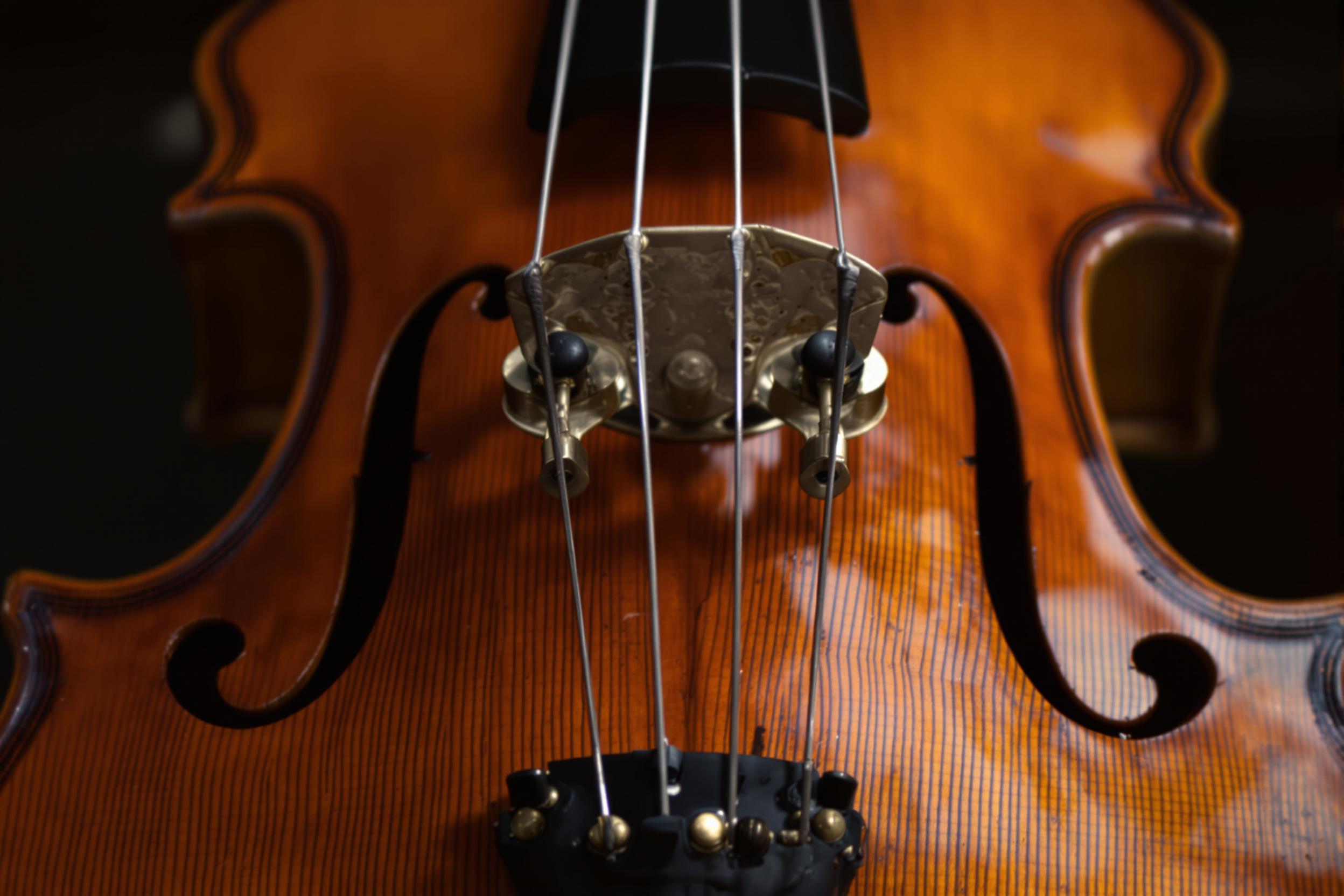 Close-Up of an Antique Violin's Amber Craftsmanship