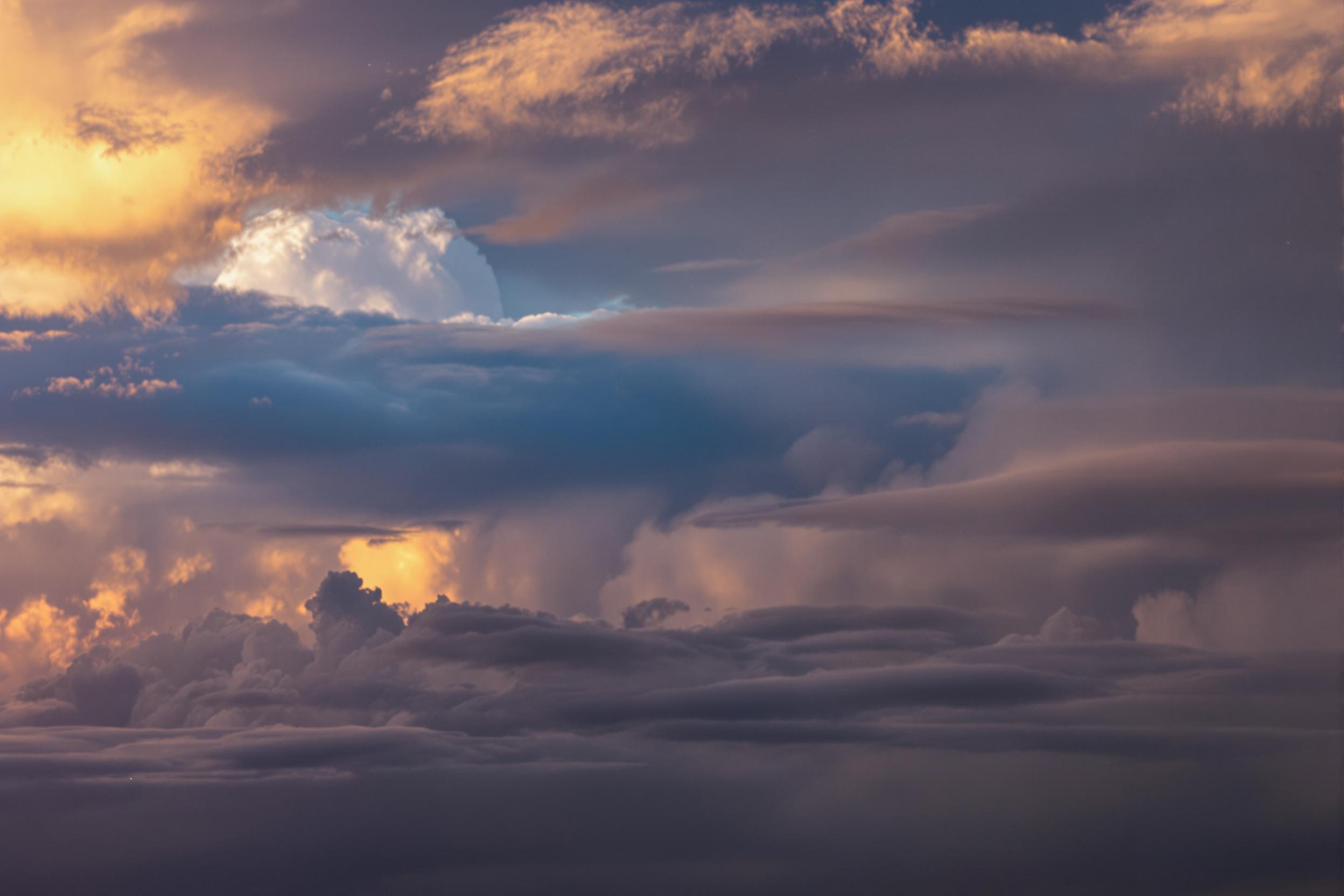 Dramatic Sunset Over Storm Clouds (Aerial View)