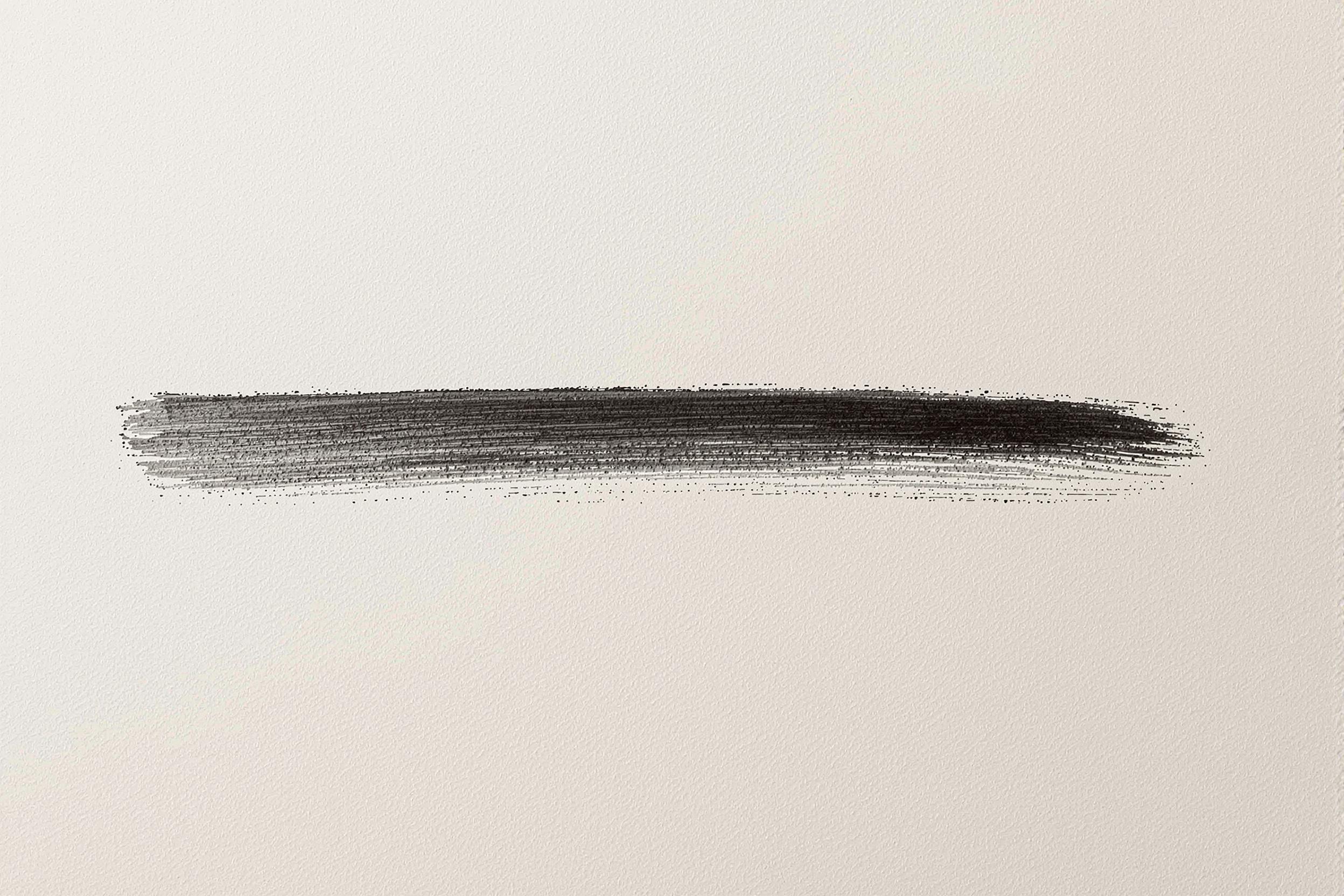 Minimal black ink brushstroke on beige cotton paper