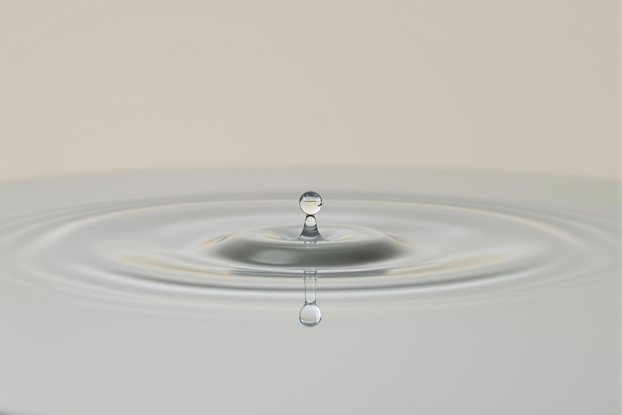 Serene Droplet and Rippling Elegance