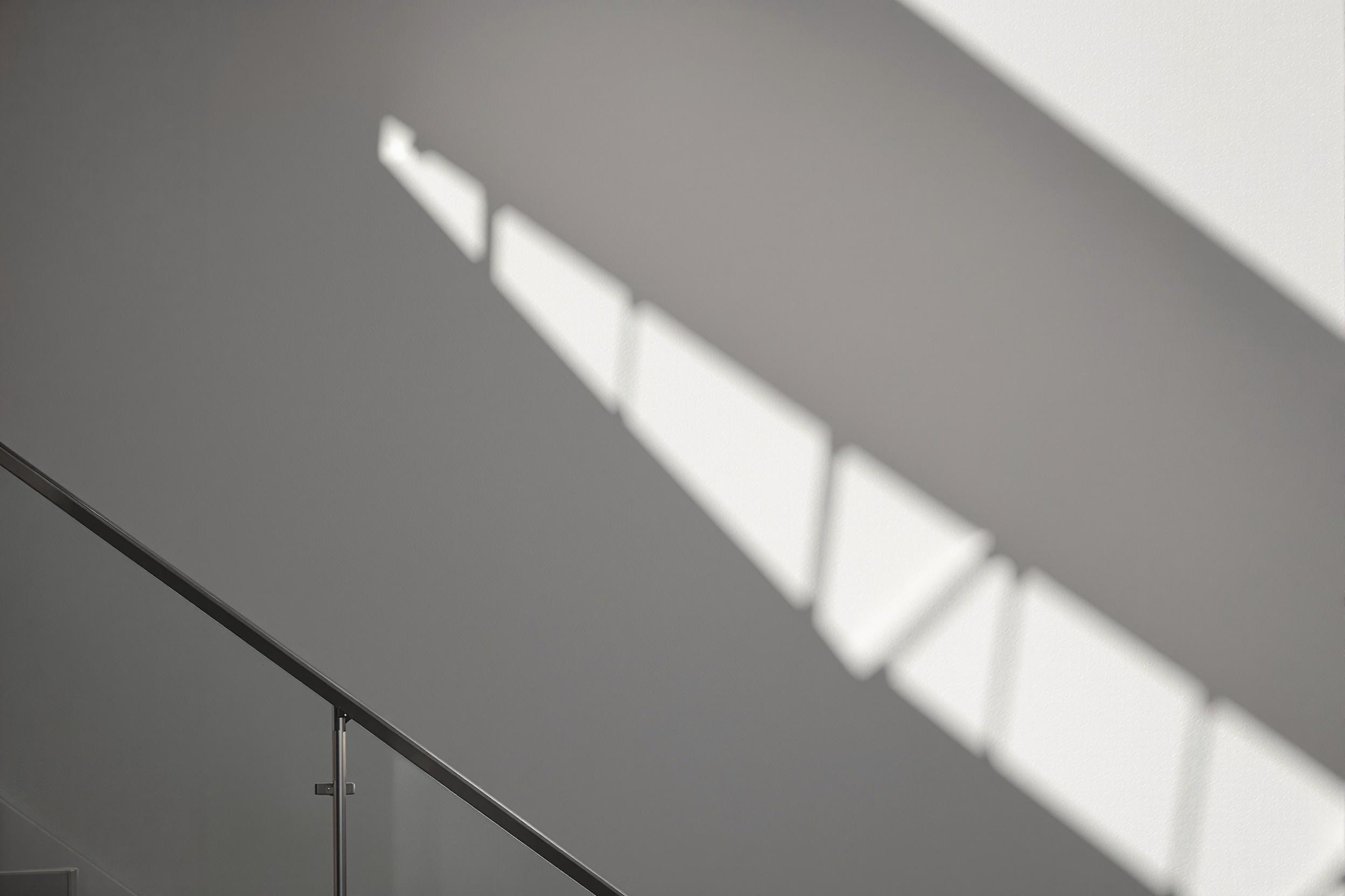 Minimalist Staircase: Geometric Shadows in Architecture