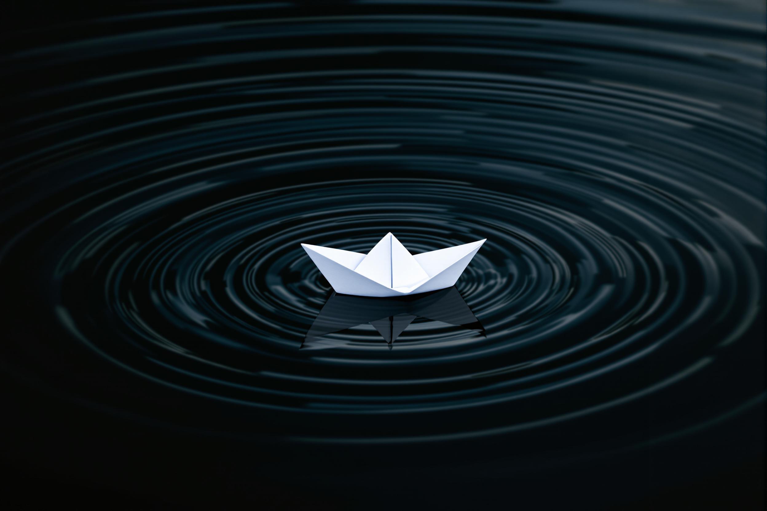 Minimalist Origami Boat on Rippling Water