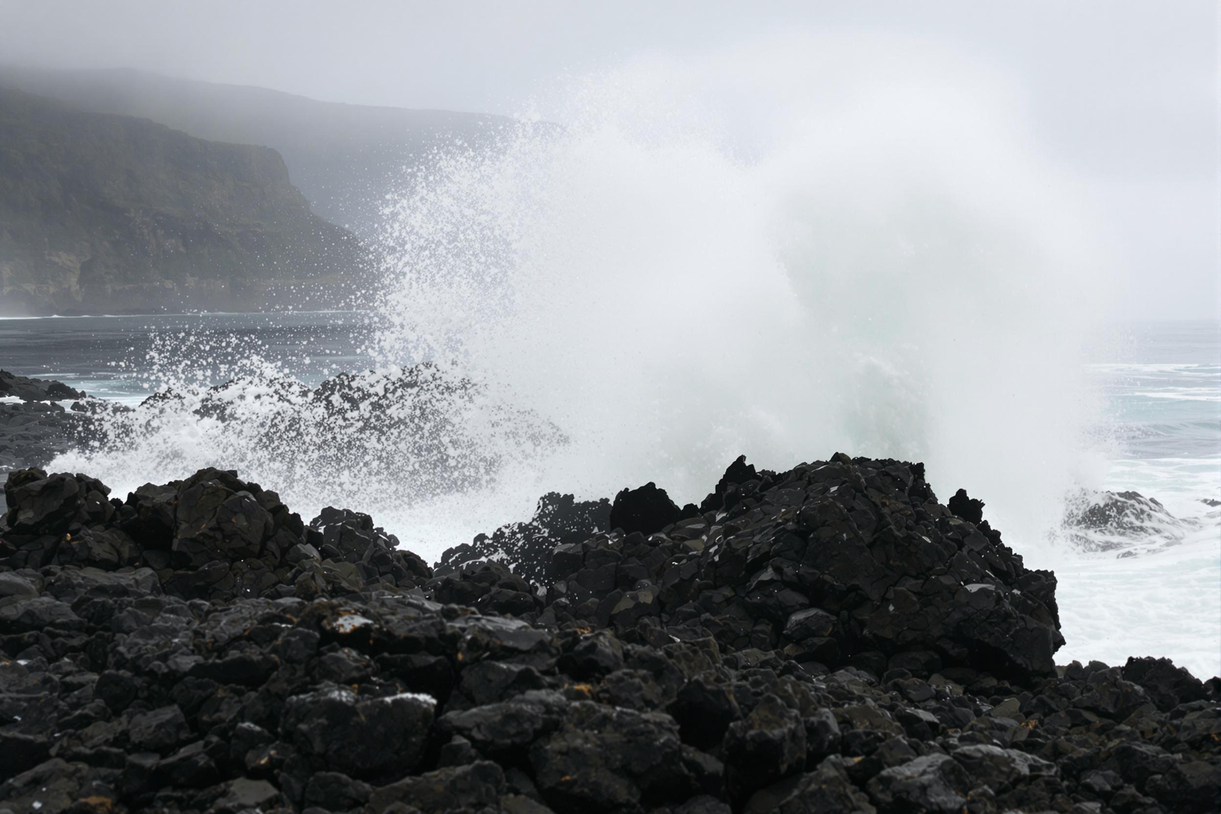 Dramatic Surf Crashing Against Volcanic Rocks