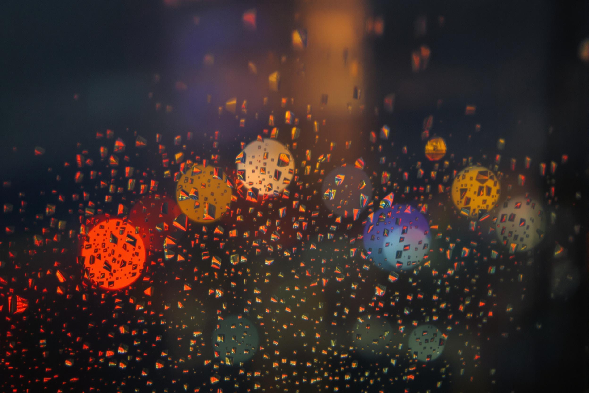 Raindrops on Airplane Window Amid Storm