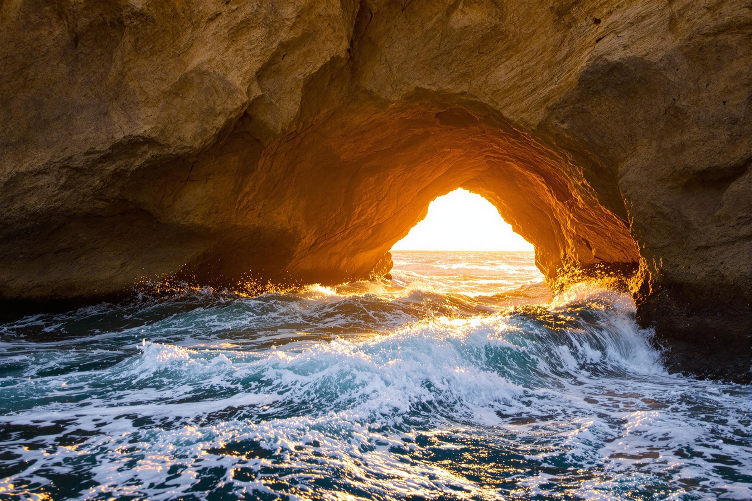 Golden Hour Rock Arch Over Turbulent Waves