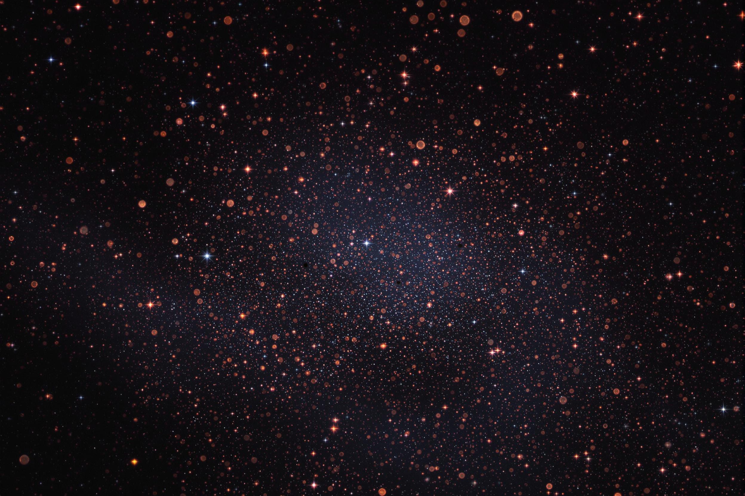Cosmic Dust Particles Illuminated by Distant Stars