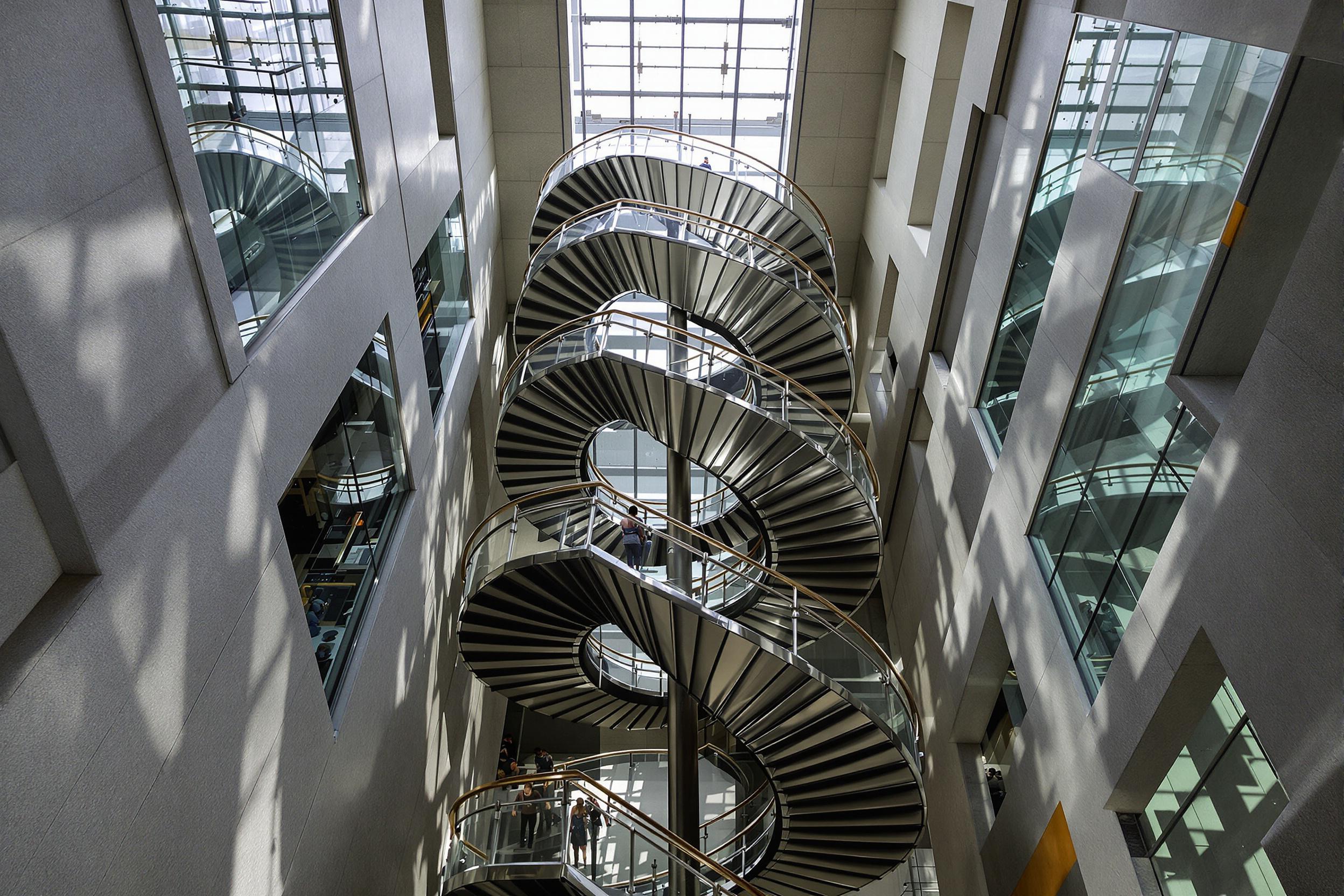 Geometric Spiral Staircase in Urban Atrium