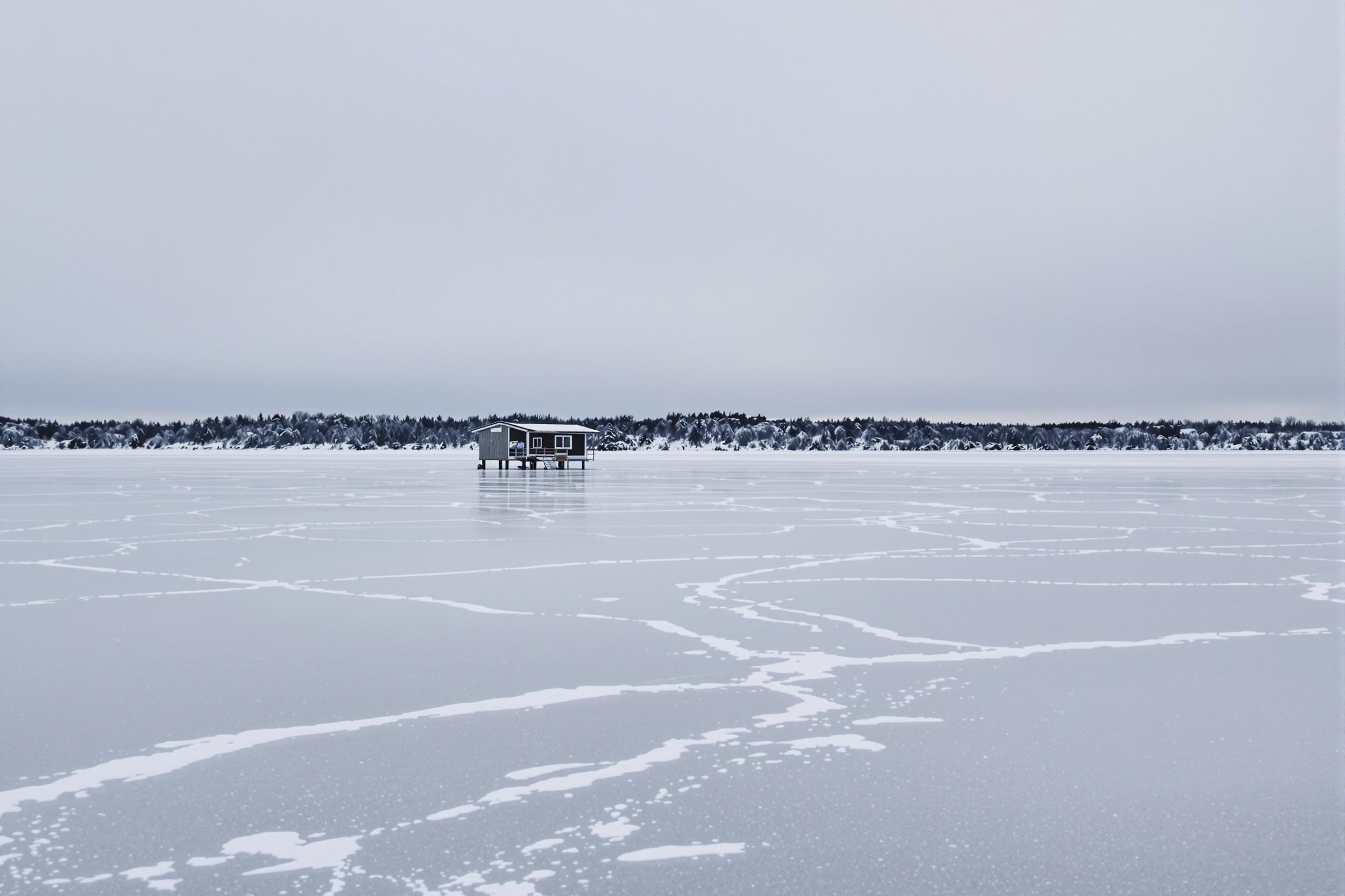 Secluded Winter Fishing Hut on Frozen Lake